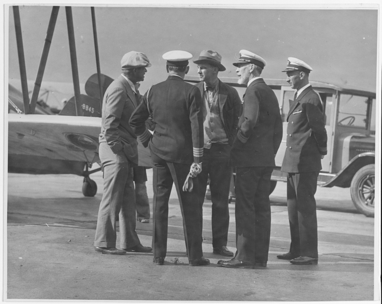 Will Rogers, Captain Arthur D. Cook, (back to camera)                         Assistant Secretary of Navy David S Ingalls, Rear Admiral Joseph M. Reeves and Commander Robert R. Paunack, CO of NAS San Diego