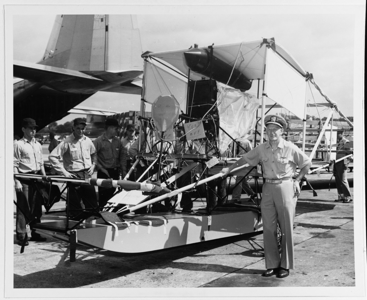 Captain George F. Rice, USN, with replica of the Curtiss A-1
