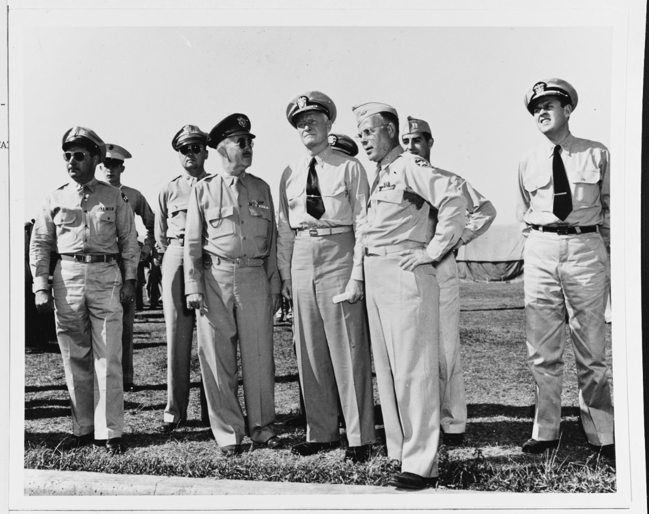 Admiral Chester W. Nimitz (CinCPac), and other (unidentified) officers attend an orientation exhibit