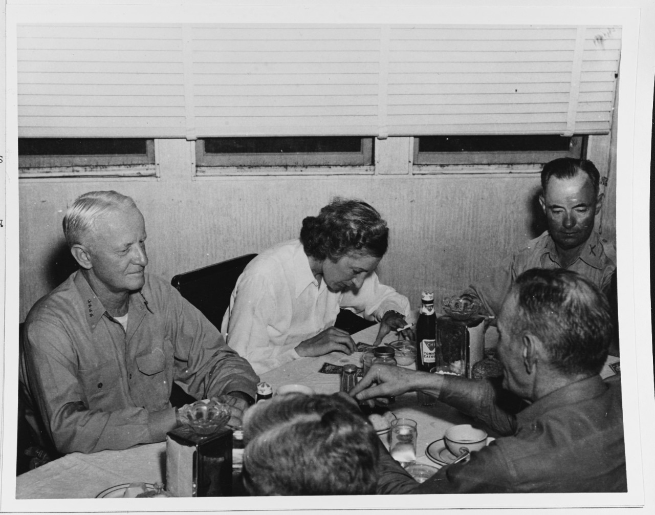 Admiral  Chester W. Nimitz (CinCPac) signing "Short-snorter bills" and enjoying lunch