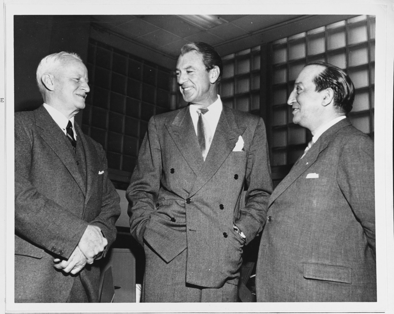 Fleet Admiral Chester W. Nimitz, (left), United Nations Designate Plebiscite Administrator for Kashmir, film actor Gary Cooper, and Mr. Benjamin Cohen (right), Asst. Secretary General for U.N. Dept. of Public Info.