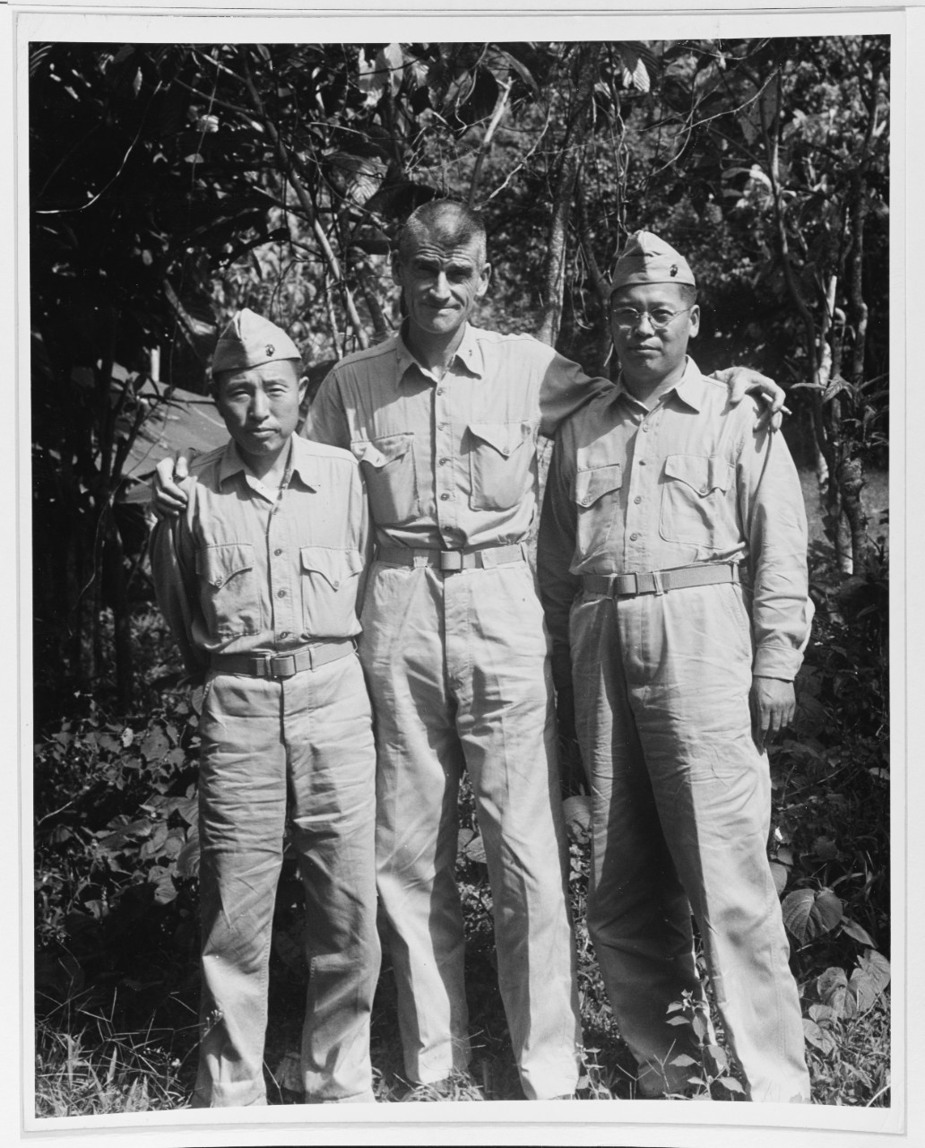 Lieutenant Colonel Evans F. Carlson, CO, Second Marine Raider Battalion with two Korean scout-interpreters
