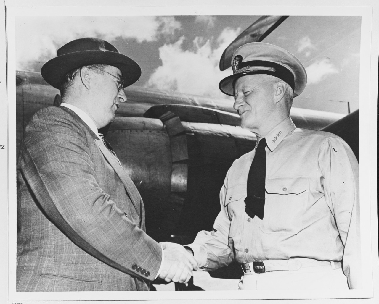 Admiral Chester W. Nimitz (CinCPac-POA) shakes hands with Mr. Donald M. Nelson, office of production management, Washington, D.C.