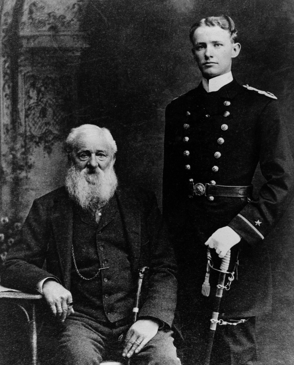 Passed Midshipman Chester W. Nimitz, USN, is shown with his grandfather, c. 1905, and probably taken in Texas. His grandfather was a retired Merchant Marine captain who greatly influenced him in having a Navy career