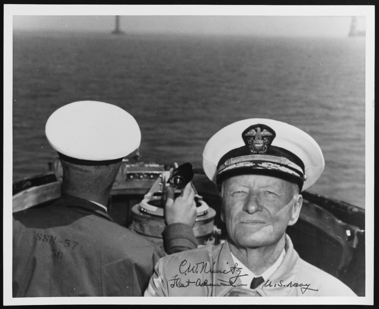 Fleet Admiral Nimitz, USN, in the Conning Tower of USS NAUTILUS (SSN-571)