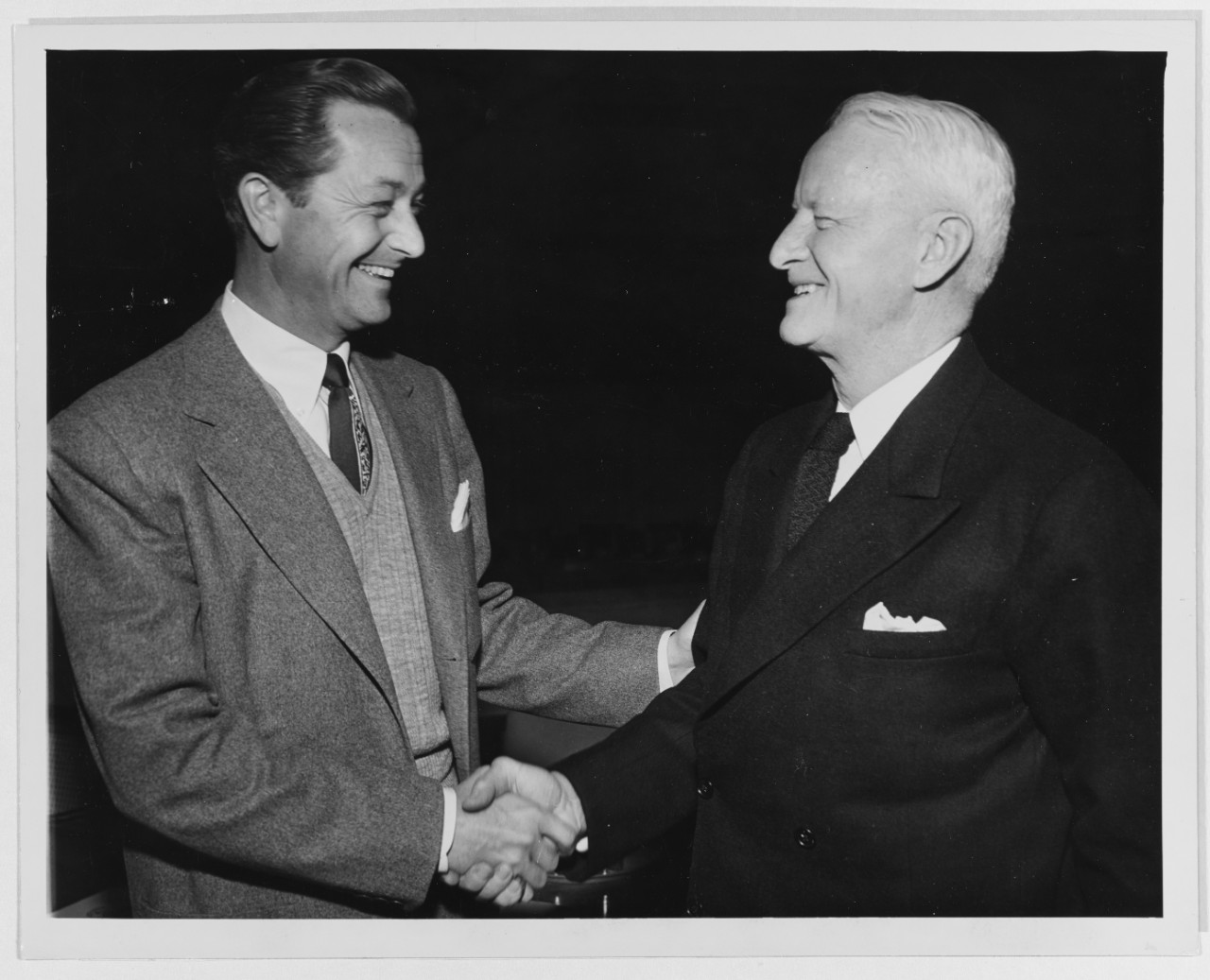 Fleet Admiral Nimitz Shakes Hands with Actor Robert Young