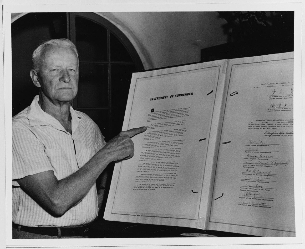 Fleet Admiral Nimitz with the Instrument of Surrender of the Japanese Empire