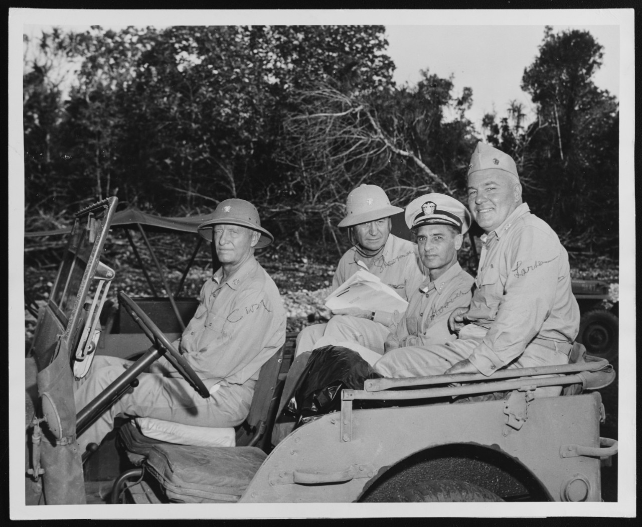 Fleet Admiral Nimitz in a Jeep on Guam with some of his Staff Officers