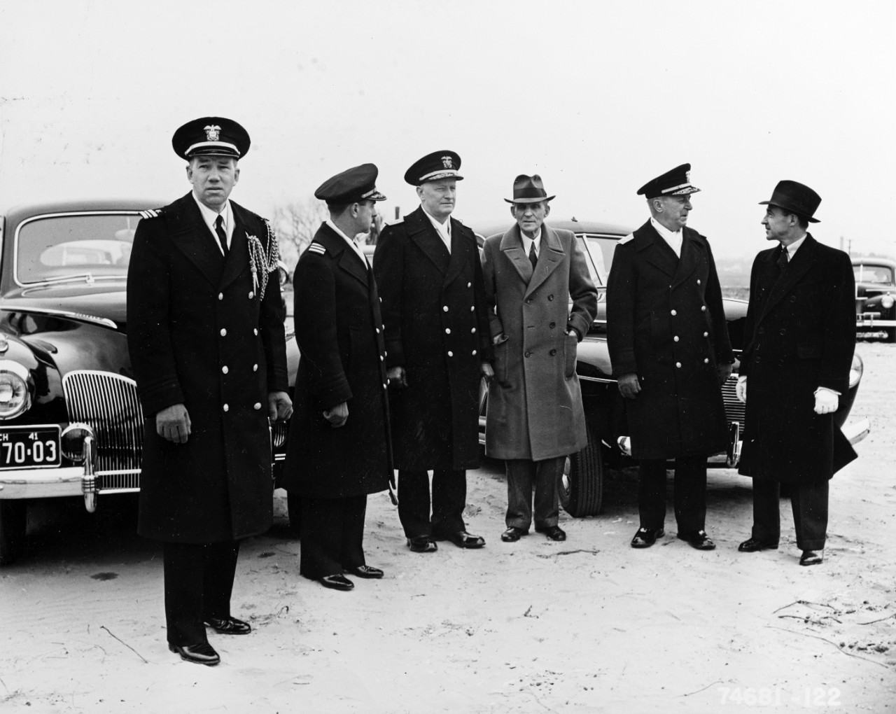 Rear Admiral Chester Nimitz, Chief of BuNav (third from left) visits Mr. Henry Ford at his River Rouge Plant. Rear Admiral John Downes, COM NINE Great Lakes, Illinois, is 2nd from right. Date was 1941.