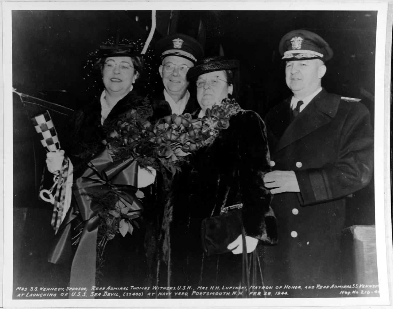 Mrs. S.S. Kennedy, Sponsor; Rear Admiral Thomas Withers, USN; Mrs. H.H. Lupinski, Matron of Honor; and Rear Admiral S.S. Kennedy, USN