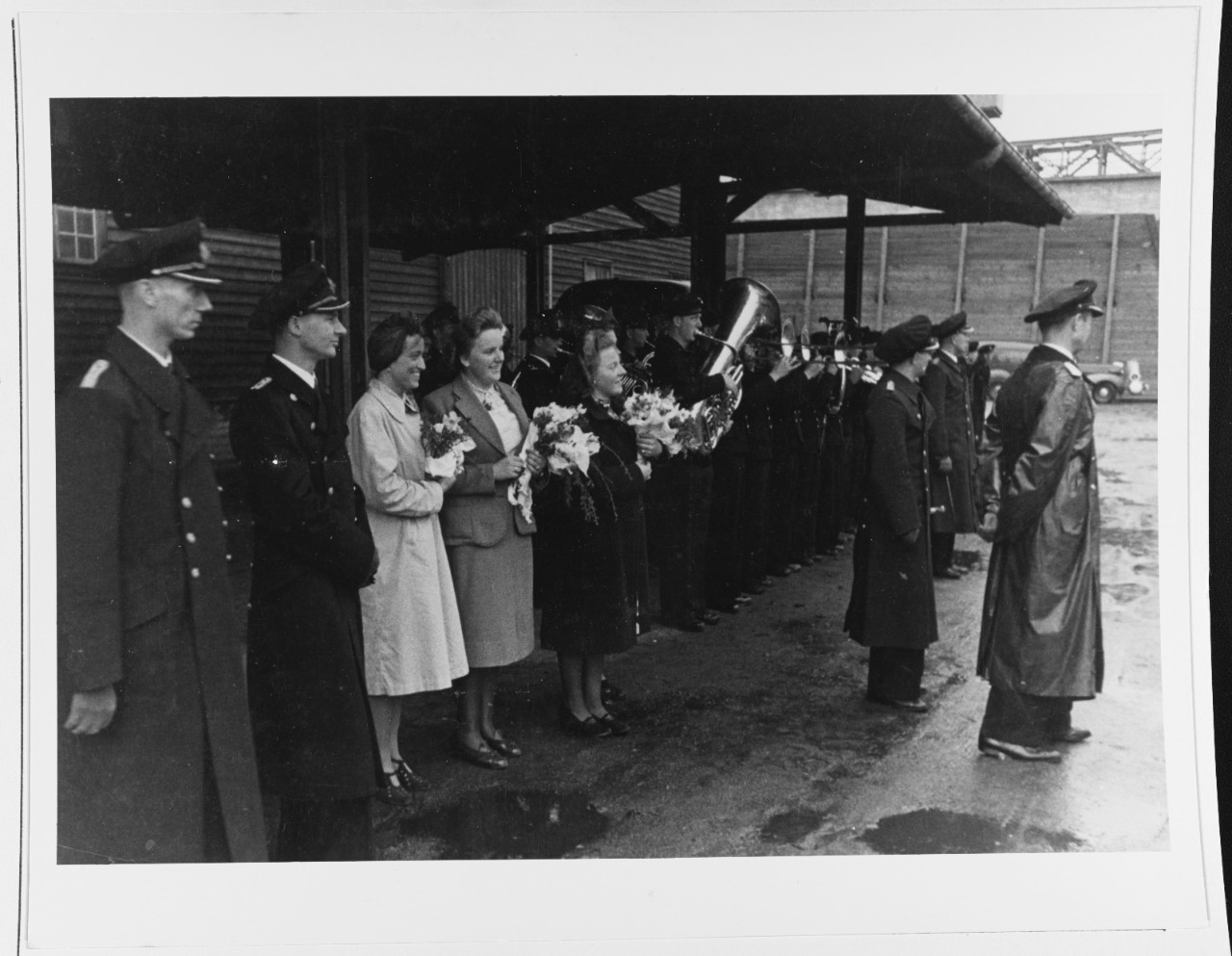 Officers, Wives, And A Navy Band Await The Arrival Of German Sumarine U-703.