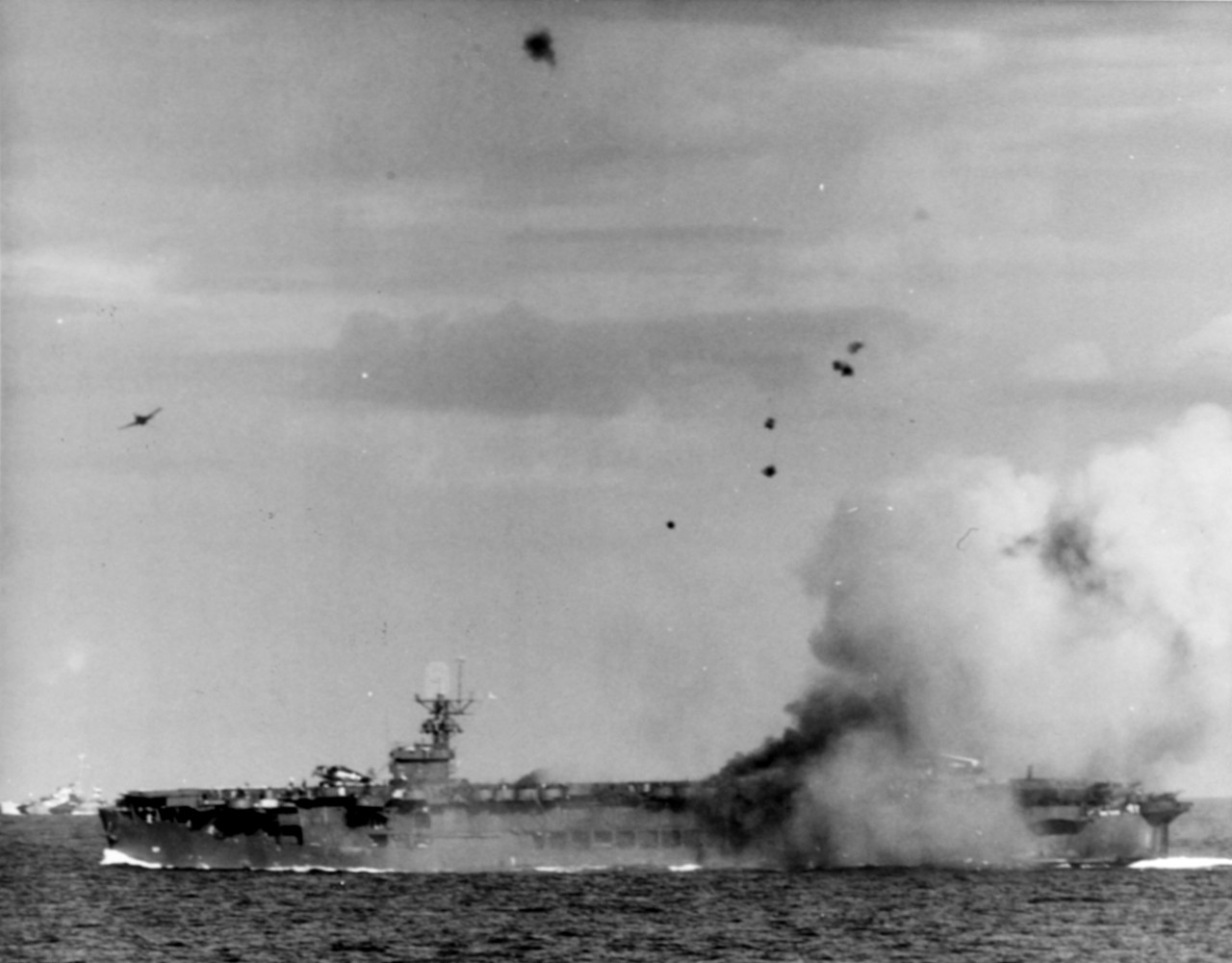F6F completing pullout after chasing Zeke which crashed into USS Suwannee (CVE-27), 25 October 1944. Taken by USS Petrof Bay (CVE-80) Air Department.