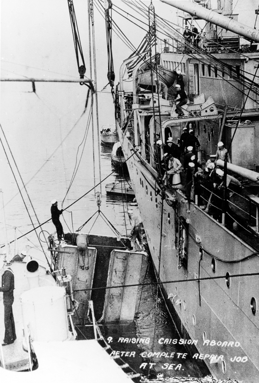 A caisson being raised back on board