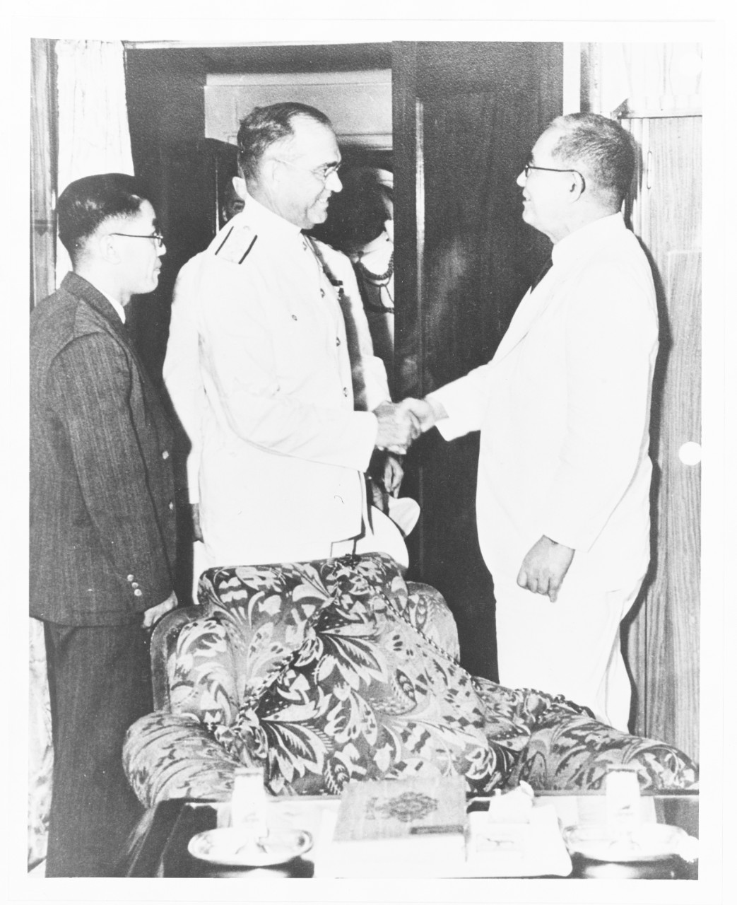 Admiral James O. Richardson, USN, Commander-in-Chief, U.S. Fleet, greets Admiral Kicharaburo Nomura, IJN, Japanese Ambassador to the United States.