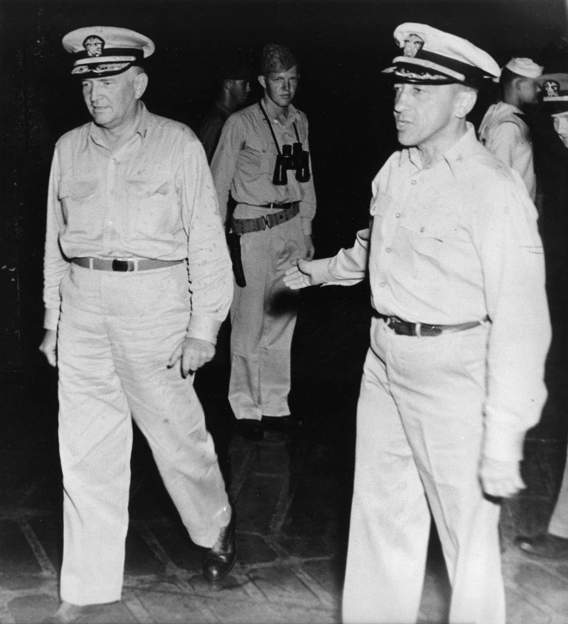 Captain T.G.W. Settle, USN (at right) with Vice Admiral J.B. Oldendorf, USN, on USS Portland (CA-33) shortly before the ceremonies at which Captain Settle would be awarded the Navy Cross after the Battle of Surigao Strait, 24-25 October 1944.
