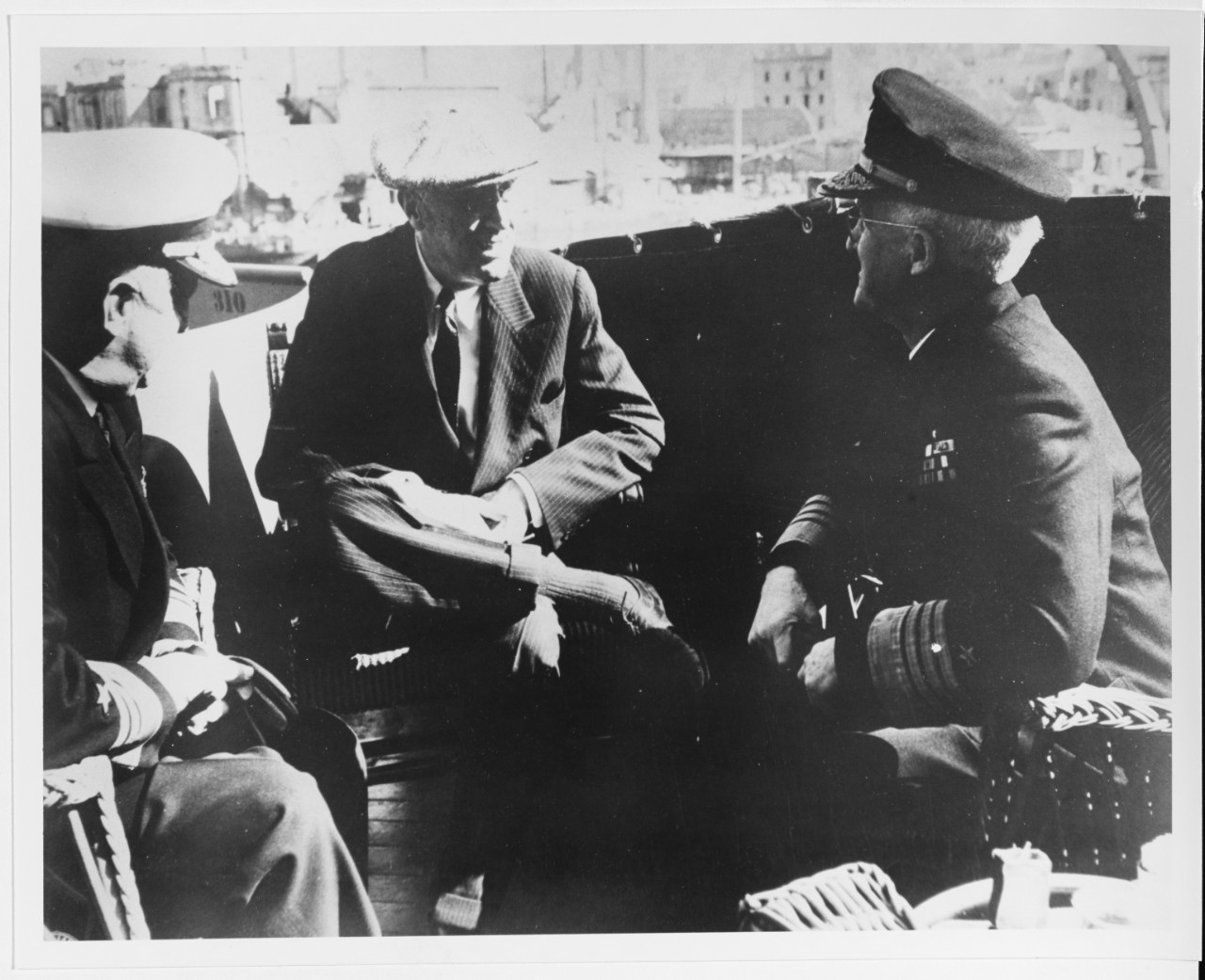 Admiral H. Kent Hewitt, USN, President Franklin D. Roosevelt, and Admiral Harold R. Stark, USN
