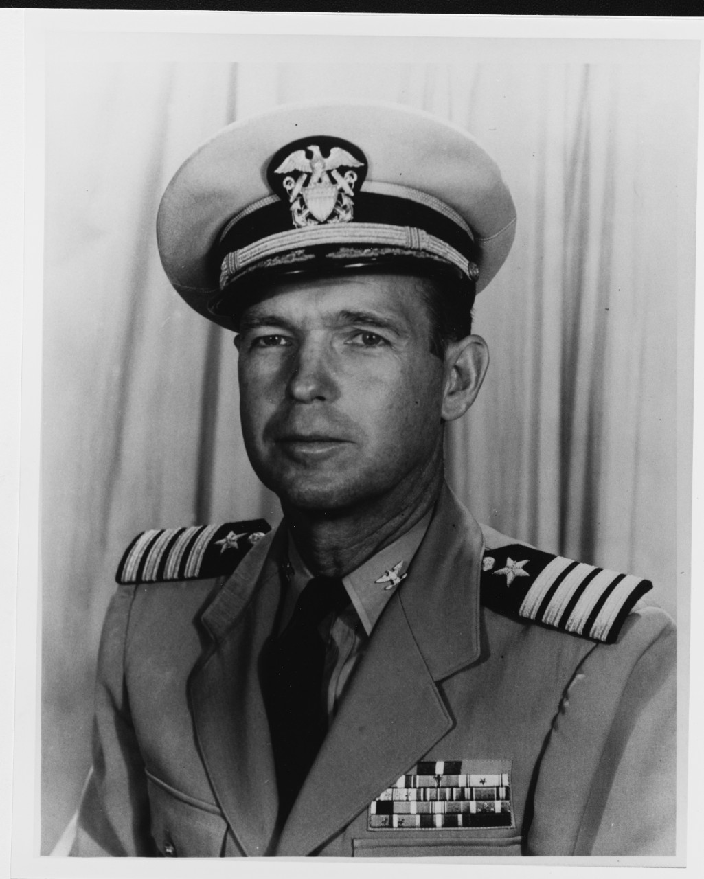 Captain Barry K. Atkins, USN