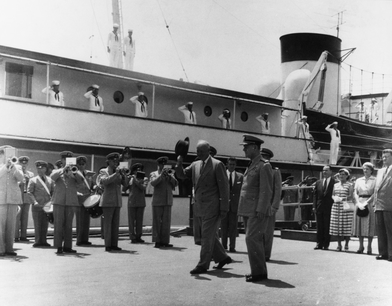 President Dwight D. Eisenhower disembarks from the presidential yacht USS Williamsburg (AGC-369) at the Washington Navy Yard, probably in May 1953