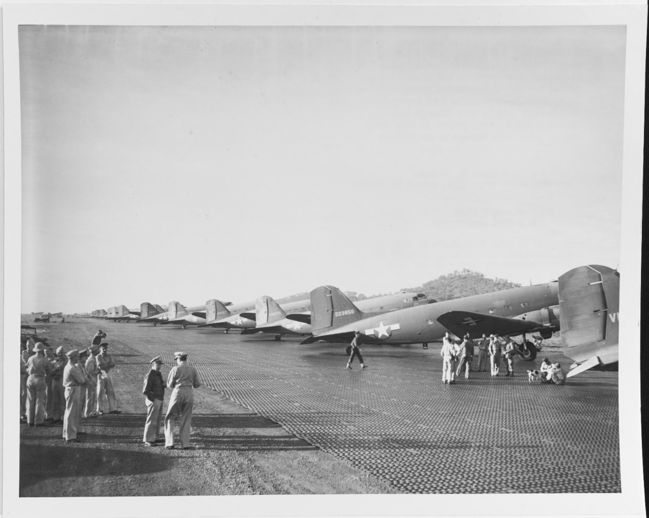 C-47 Transport planes at New Guinea loaded with paratroopers. General Douglas Macarthur and Lieutenant General George Keaney, US Army, Commanding General, Fifth Air Force, September 1943.