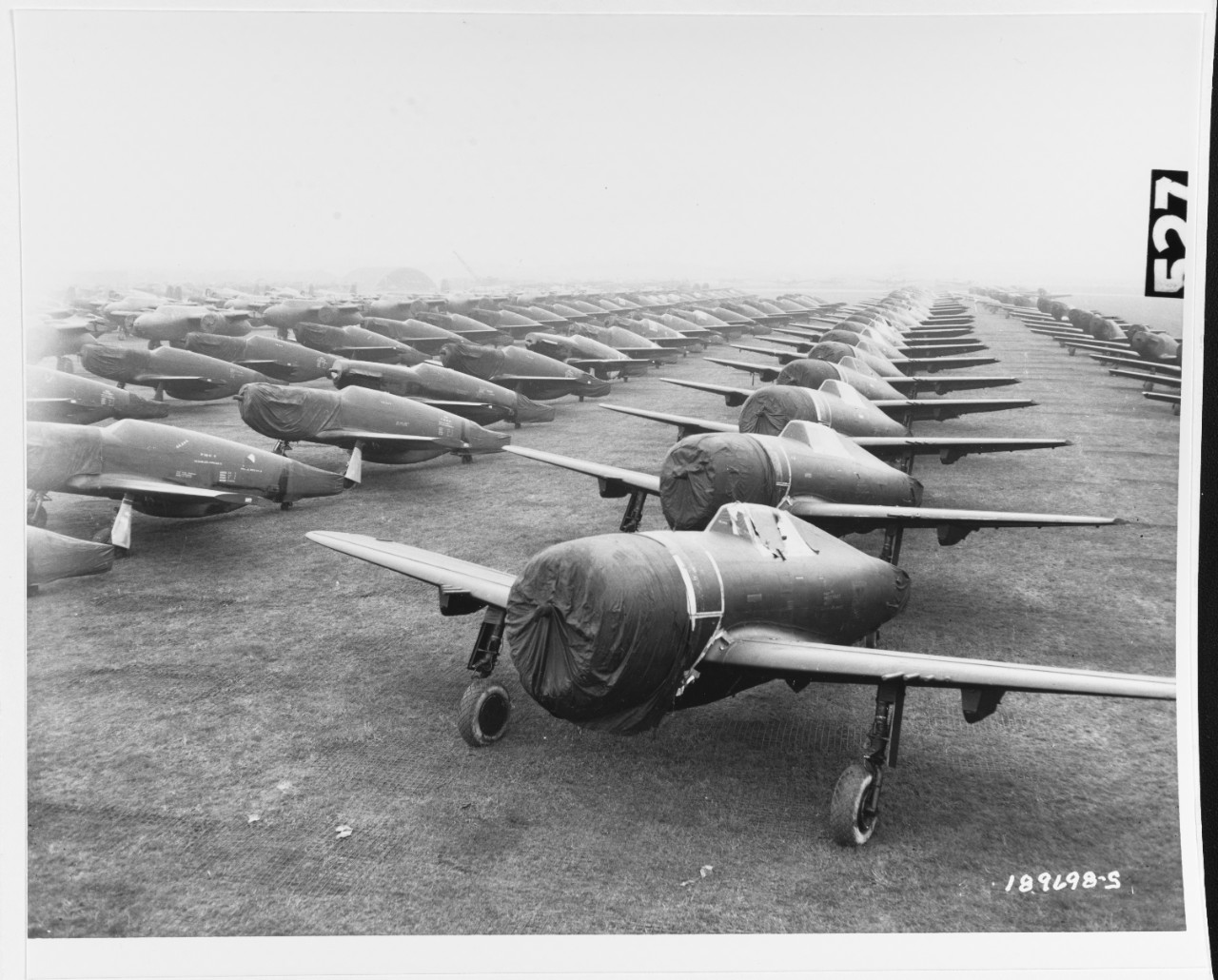 U.S. Army Air Forces Aircraft await assembly in an English field, after being transported by ship across the Atlantic. 13 April 1944.