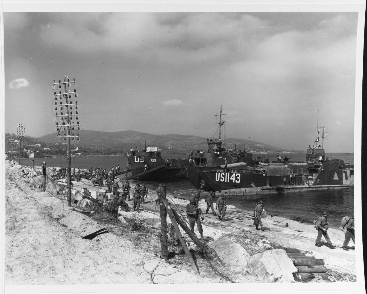 Southern France Invasion, August 1944. USS LCI-513 and LCT-1143 unloading on a Southern France beach, on "D-Day"