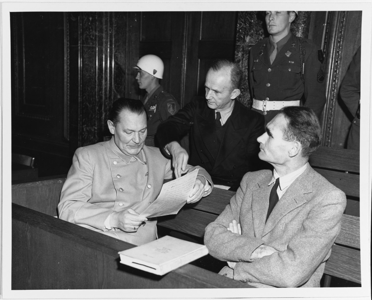 Nuremburg Trials, 1945-1946. Admiral Karl Doenitz confers with Herman Goering before court convenes