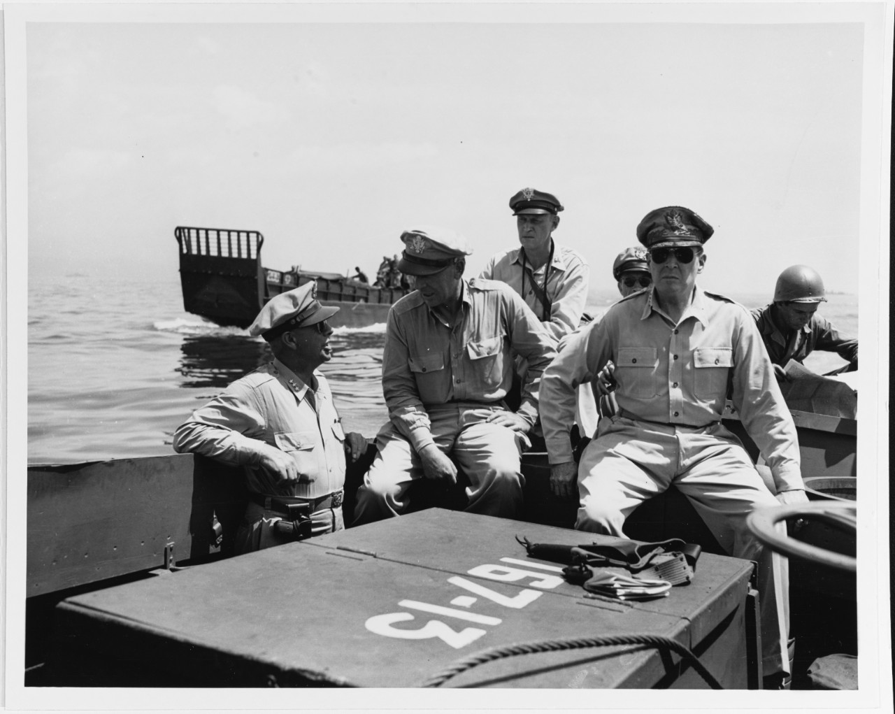 Lieutenant General George C. Kenney, Lieutenant General Richard K. Sutherland, General Douglas MacArthur inspect the beachhead on Leyte Island, P.I. , October 20, 1944.