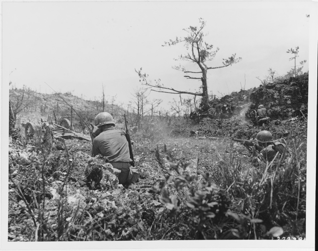 Okinawa, Ryukyus Island. June 20, 1945. The riflemen of the 305th Regiment, 77th Division, fire at a cave