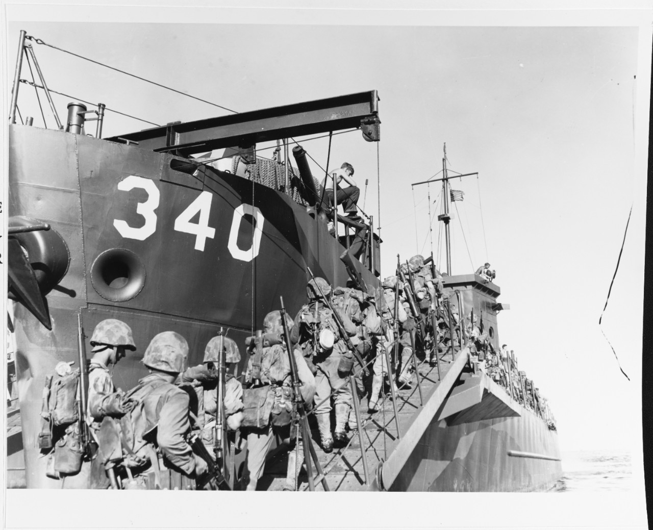 Marines boarding USS LCI-340 on the day before Christmas, 1943