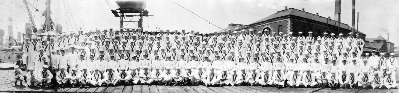 Officers and crew of USS Chester (CL-1) posing aboard their ship at Boston Navy Yard, MA, ca. 1919. There is an extra copy of this print enclosed.