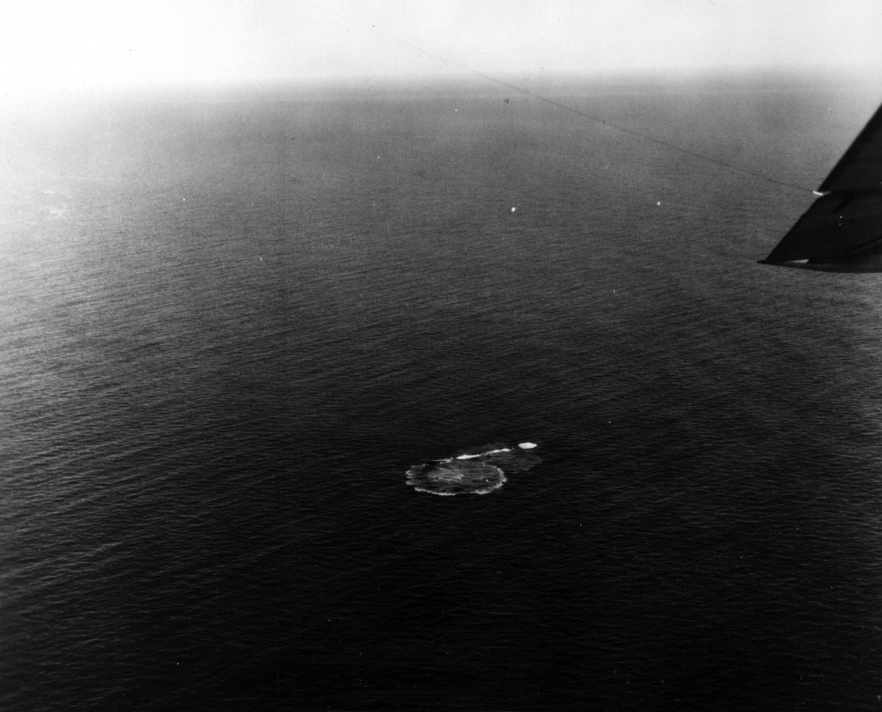 USS Bass (SS-164) sinks off Block Island, NY, during tests. Photographed by aircraft of Anti-Submarine Development Detachment, Air Force, U.S. Atlantic Fleet.