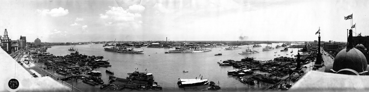 View of U.S. and foreign naval vessels anchored off the Bund in Shanghai, China, ca. 1937 including: USS Augusta (CA-31), HMS Duchess (CL), HMS Falmouth (PF), French cruiser Lamotte Picquet (CL), French gunboats Savorgnan de Brazza (PG) and Dumont D'Urville (PG), Italian minelayer Lepanto, Dutch destroyer Van Galen, USS Sacramento (PG-19), and an unknown Japanese hospital ship.