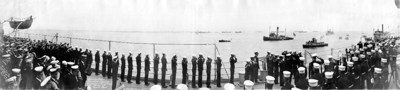 Crew of USS Pennsylvania (BB-38) saluting as President Warren G. Harding leaves the ship, off Hampton Roads, VA, following the Review off Thimble Shoals, April 28, 1921. 