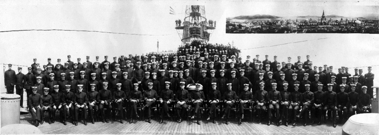 Oversize panoramic of the officers, crew, and U.S. Naval Academy midshipmen on the forecastle of USS Wisconsin (BB-9) while visiting the Panama-California Exposition, San Diego, CA, August 6, 1915. From the collection of CAPT Perry R. Taylor taken during is 1915 midshipman cruise to the West Coast. 