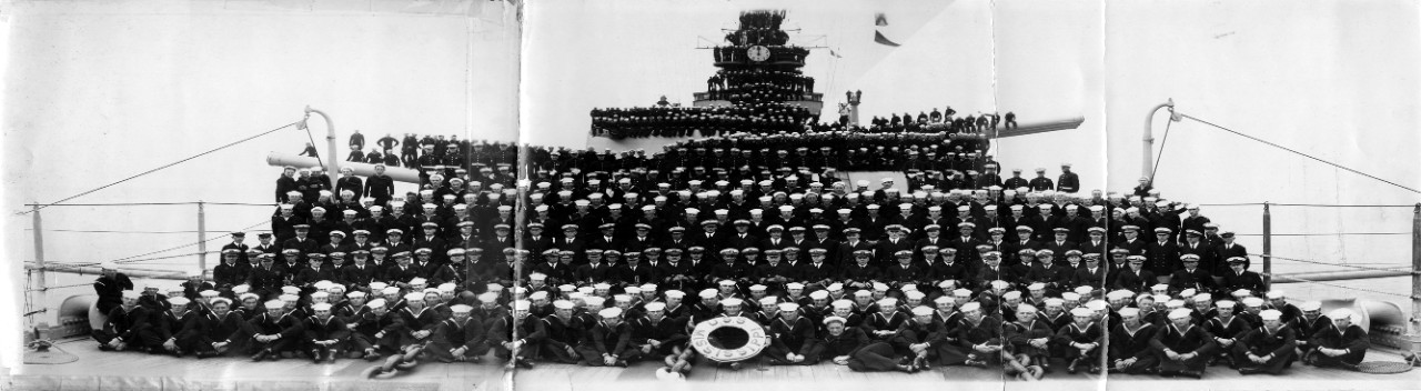 Officers and crew USS Mississippi (BB-41). Significant damage to photograph - tear down the center of the image. Image is part of the Ray S. Jones collection. 