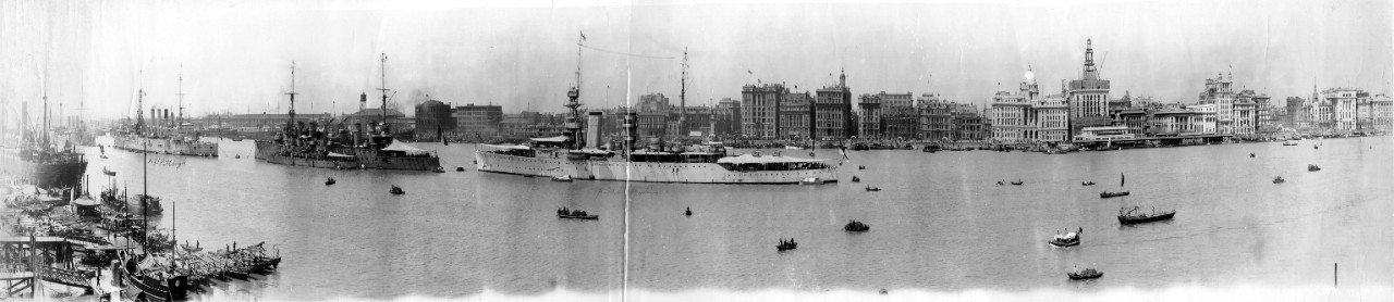 Panoramic photograph of Shanghai, China, circa  1928- river & city view showing various ships, including USS Pittsburgh (CA-4) & HMS Hawkins.