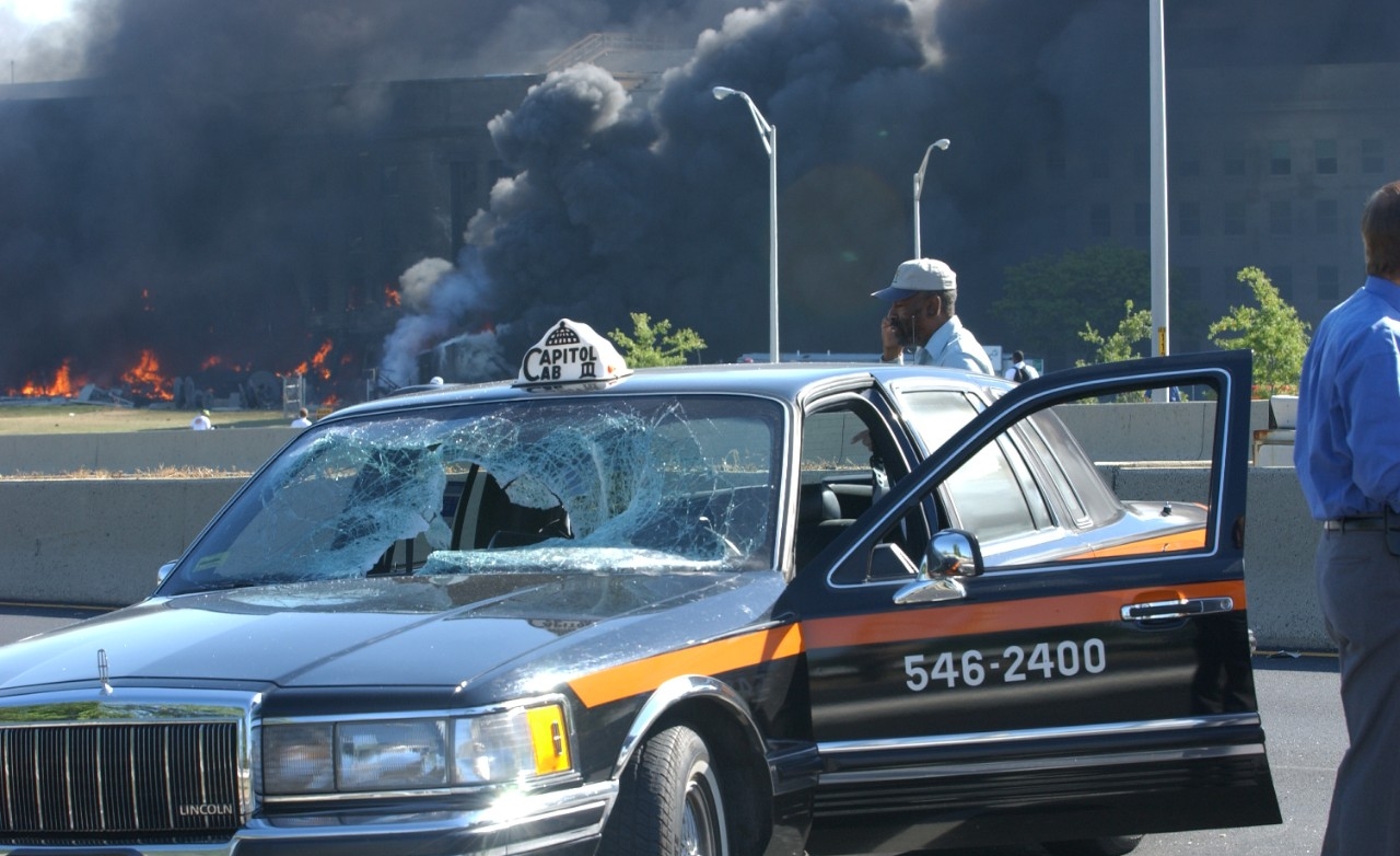 A taxi driving along VA-27 S Washington Blvd was struck by a falling lightpole that had been knocked down by the plane in the seconds before it hit the Pentagon, 11 September 2001