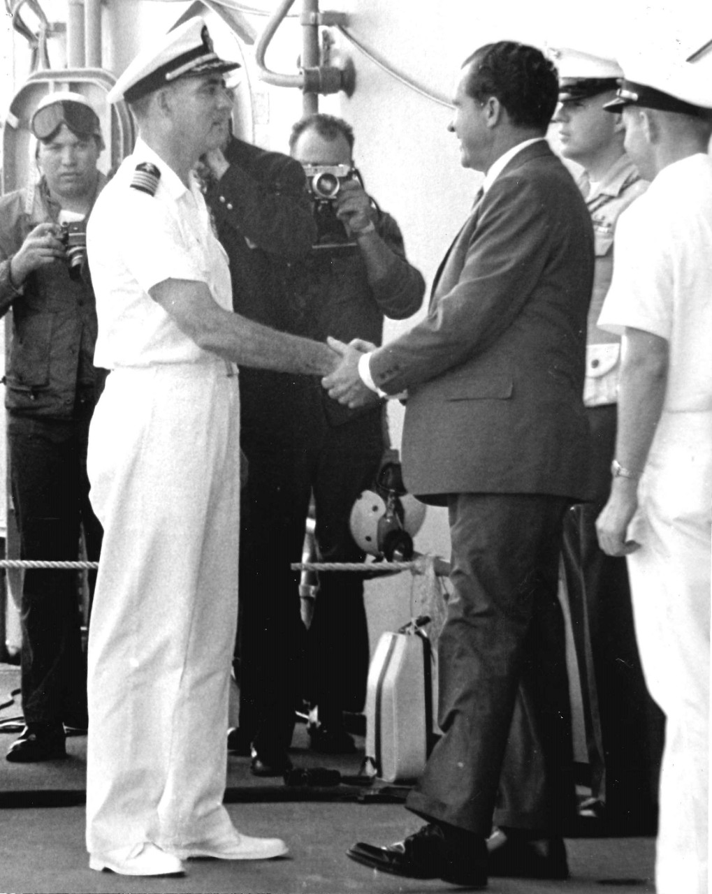 <p>Captain Carl Seiberlich shakes hands with President Richard M.&nbsp;Nixon aboard USS Hornet (CVS-12).</p>
