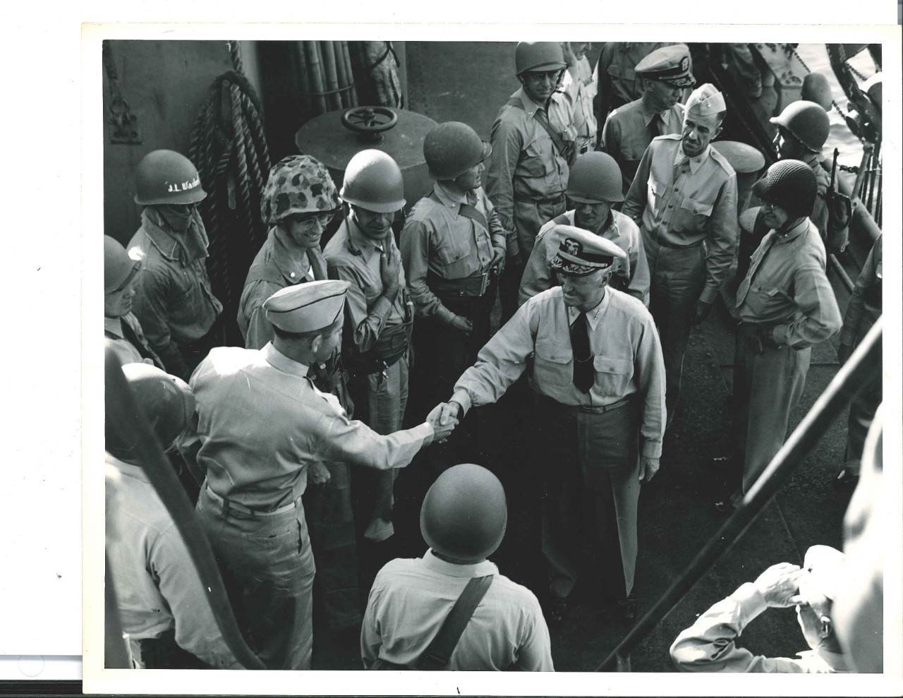 <p>Admiral Chester W. Nimitz greeting Navy personnel during the Iwo Jima campaign</p>
