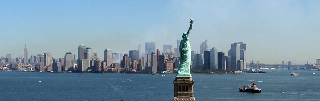 <p>Smoke rises from Lower Manhattan as the Statue of Liberty maintains her position in New York Harbor, 17 September 2001</p>
