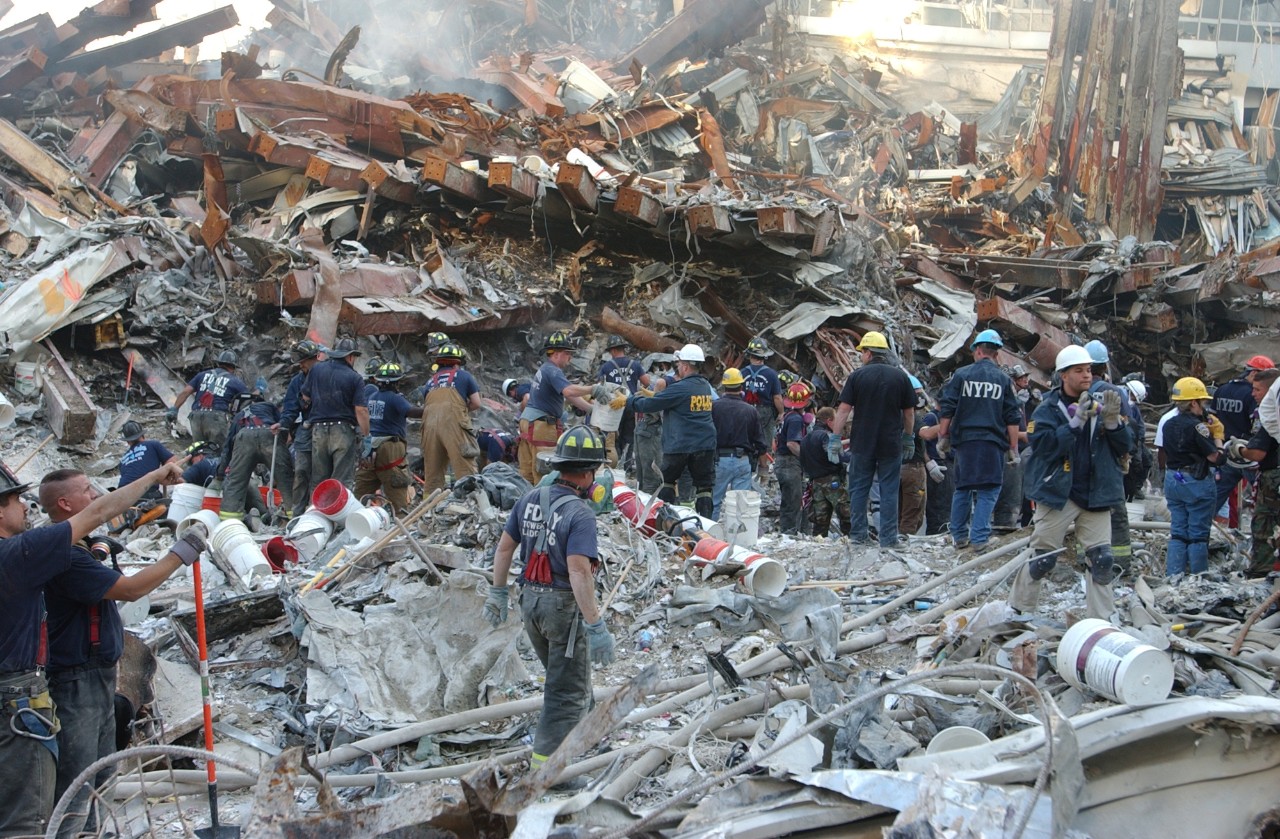 New York City police and fire personnel work at Ground Zero in New York City following the attacks on 9/11, 16 September 2001