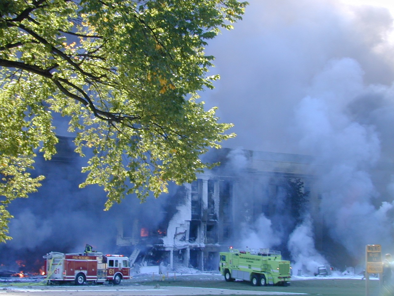 The first fire teams begin working to put out the flames in the minutes after the attack, 11 September 2001