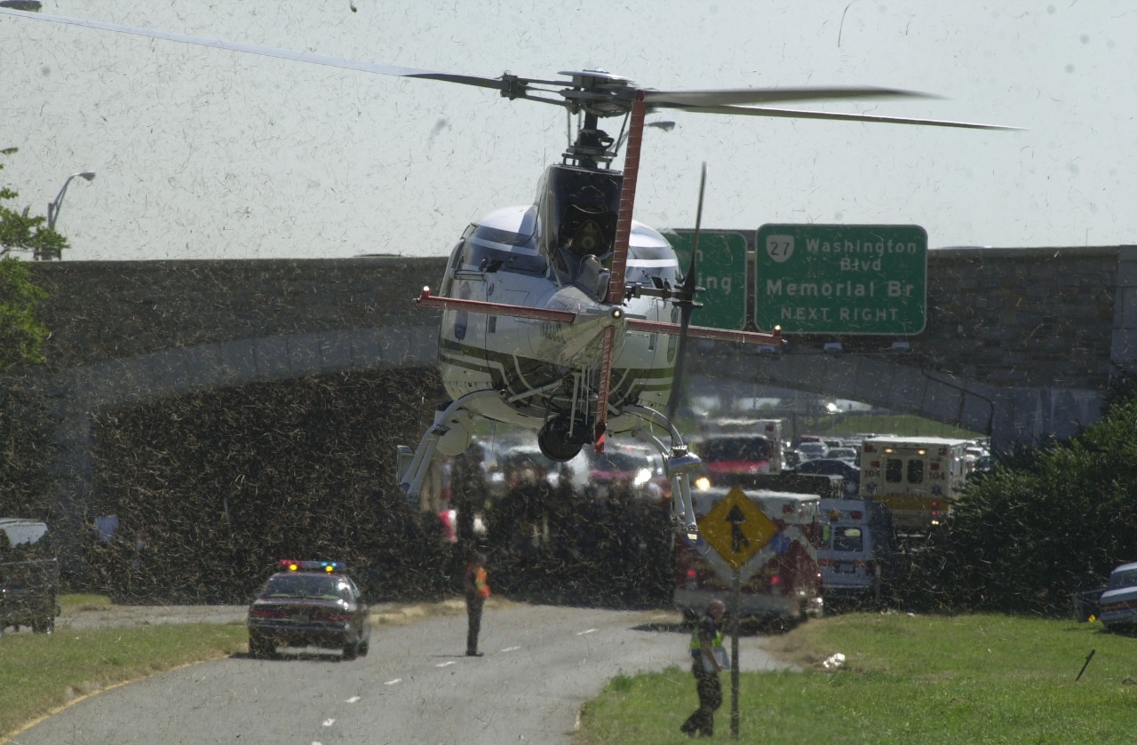 An emergency response helicopter lands on Columbia Pike outside of the Pentagon, 11 September 2001