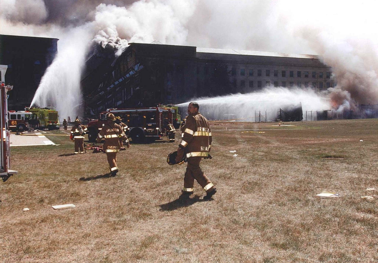 Fire crews work to put out the flames following the collapse of the E Ring, 11 September 2001
