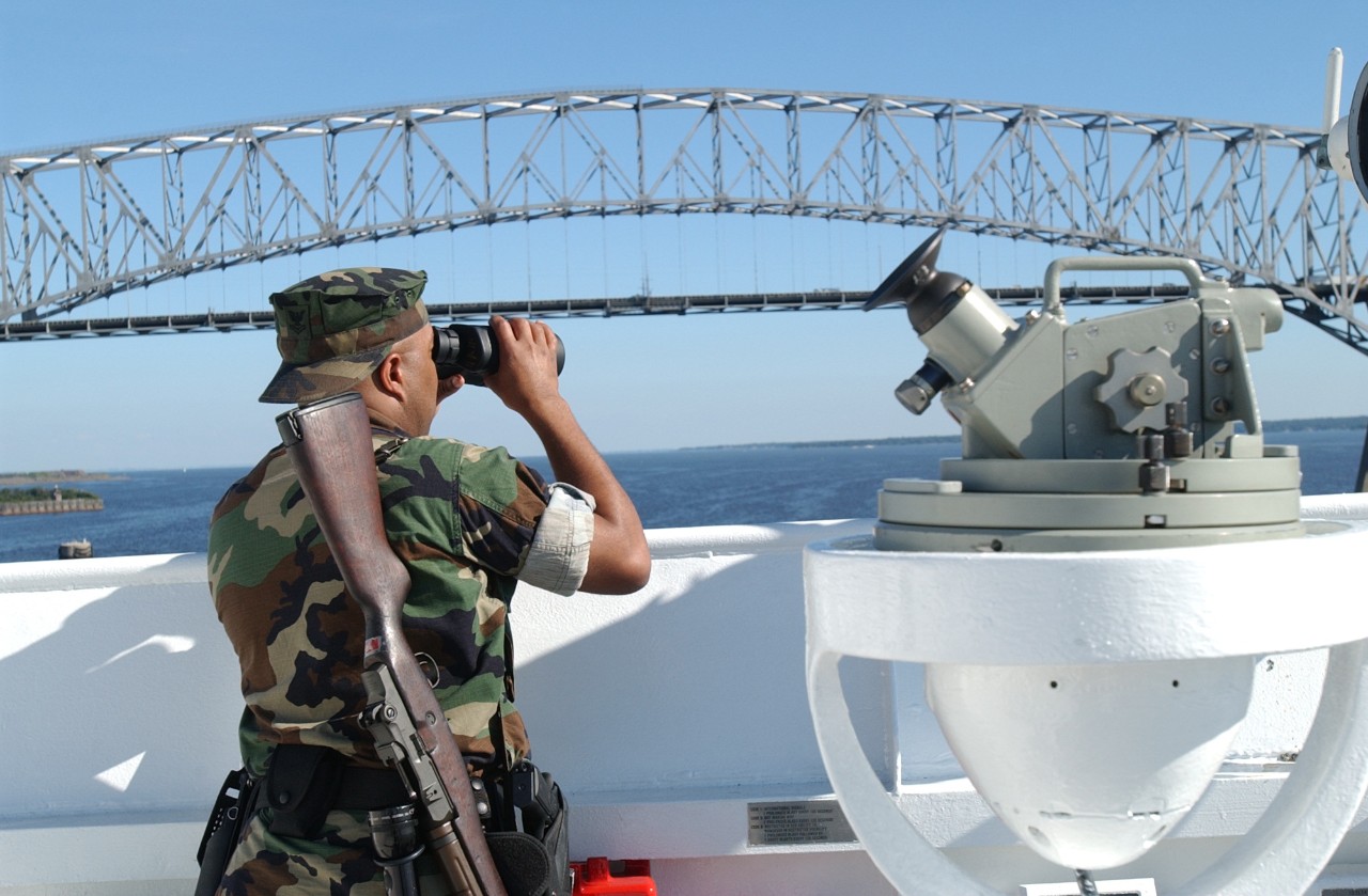 Standing watch on the bow of USNS COMFORT (T-AH 20) as it sails out of Baltimore Harbor on 12 September 2001