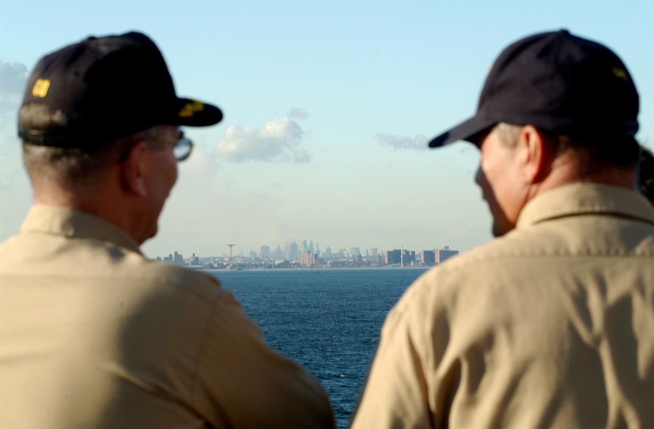 Smoke rises from Lower Manhattan as USNS COMFORT (T-AH 20) sails into New York Harbor on 14 September 2001