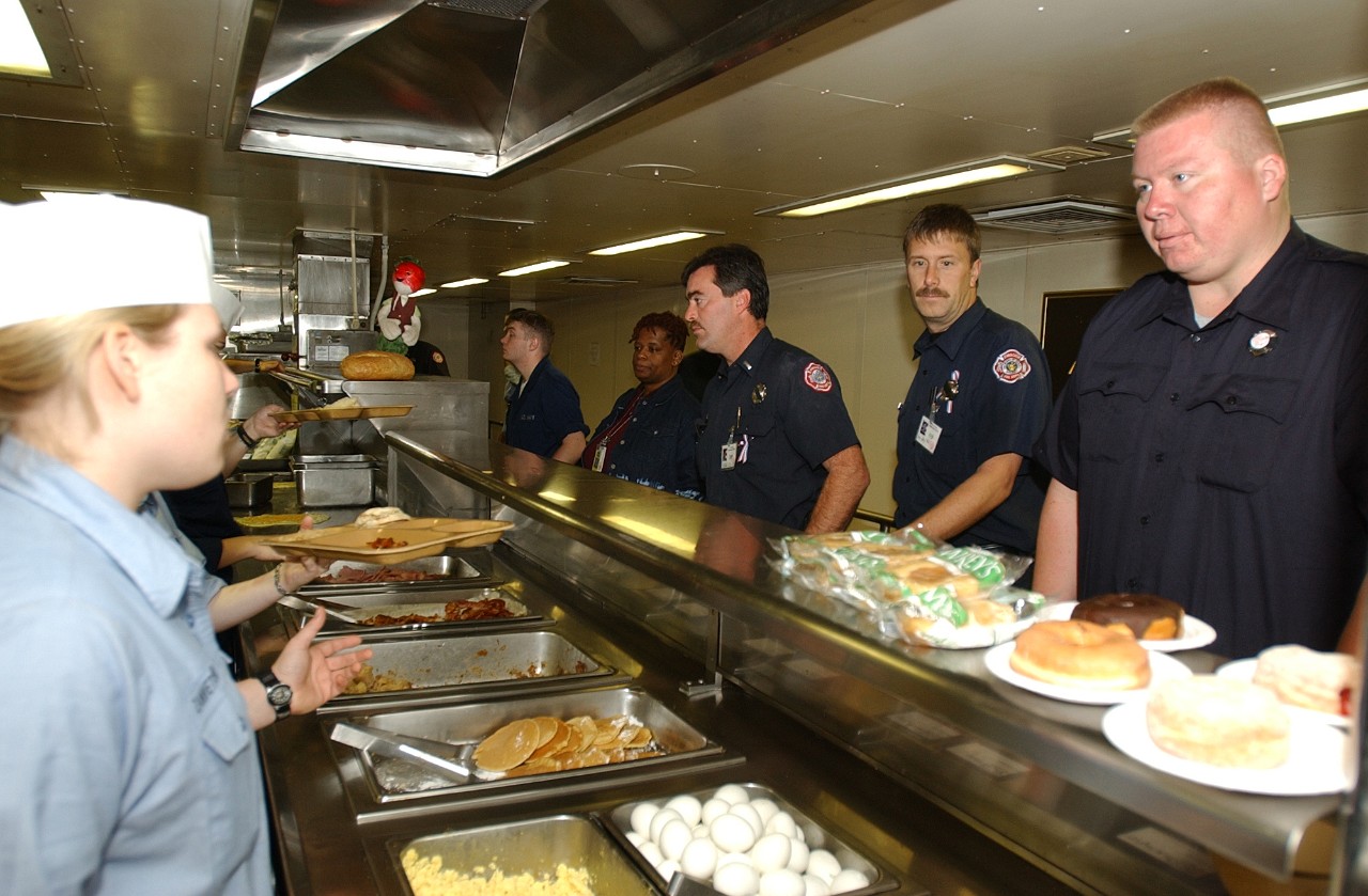 Sailors aboard USNS COMFORT (T-AH 20) feed firemen, policemen, and volunteers who are working at Ground Zero in New York City, 19 September 2001