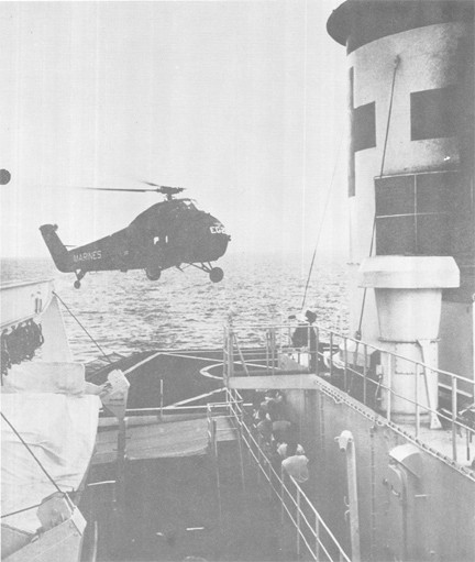 Image of Marine Helicopter With Wounded Leatherneck on Board Prepares to Land on USS REPOSE (AH 16) in South China Sea