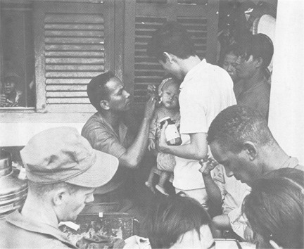 Image of U.S. Medical Personnel Administer Aid to Vietnamese People