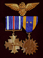 photograph of Medals won by George Bush: Distinguished Flying Cross and Air Medal with two stars